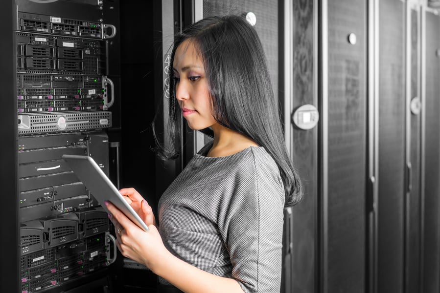 young-engineer-businesswoman-with-tablet-in-network-server-room_t20_mveW63